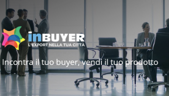 Immagine di incontro d'affari sulla sfondo, con lo slogan "Inbuyer: l'export nella tua città"